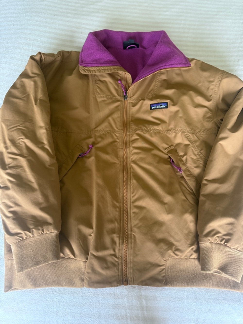 Patagonia tan jacket with purple lining